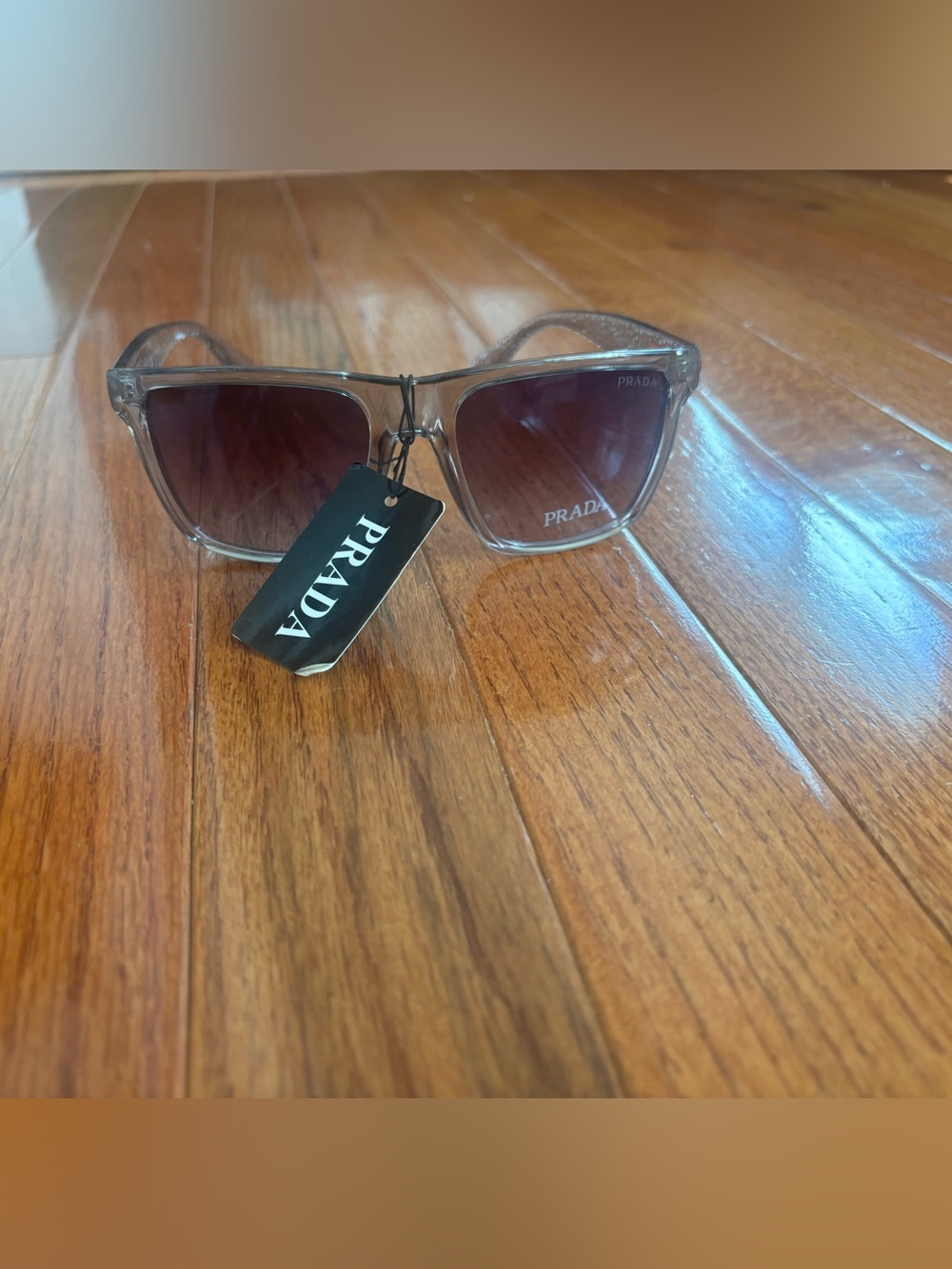 Prada Men’s Transparent Frame Sunglasses with Gradient Brown Lenses
